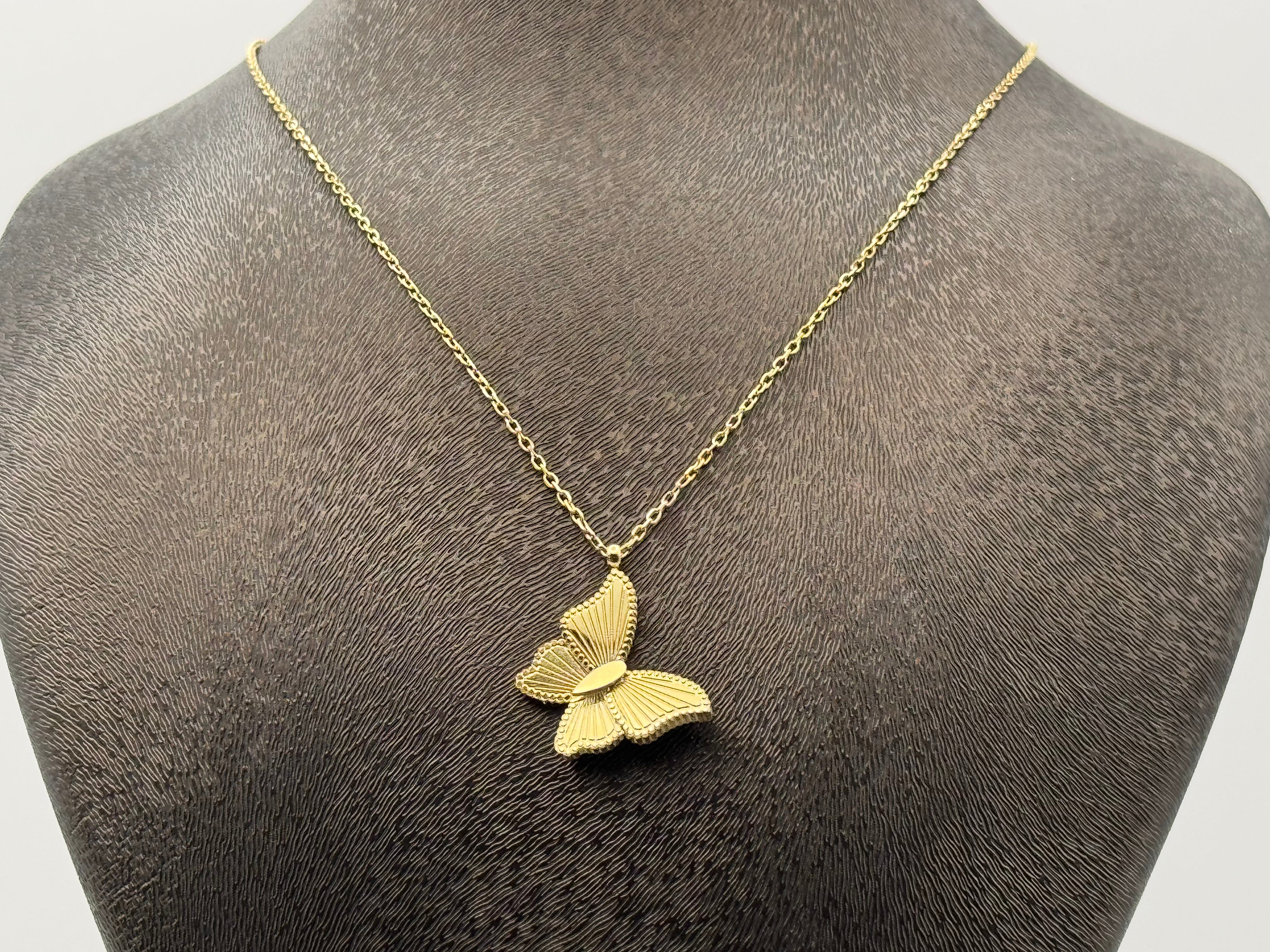 Large gold-colored slanted butterfly